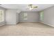 Large bonus room with multiple windows and plush carpeting at 470 Piney Sw Way, Atlanta, GA 30331