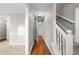 Hallway with hardwood flooring and a staircase leading to the upper level at 470 Piney Sw Way, Atlanta, GA 30331