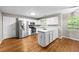 Spacious kitchen with stainless steel appliances, island, and hardwood floors at 470 Piney Sw Way, Atlanta, GA 30331