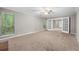 Spacious living room with plush carpet, French doors, and ample natural light at 470 Piney Sw Way, Atlanta, GA 30331