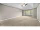 Spacious main bedroom with a trey ceiling, ceiling fan and large windows at 470 Piney Sw Way, Atlanta, GA 30331