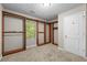 A large walk-in closet with custom built-in shelving and natural light at 470 Piney Sw Way, Atlanta, GA 30331