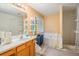 Bathroom featuring a vanity with sink, built-in tub, and shower at 4732 Browns Mill Ferry Rd, Lithonia, GA 30038