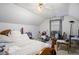 Bedroom featuring a bed, a window, and desk with natural light at 4732 Browns Mill Ferry Rd, Lithonia, GA 30038