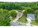 Aerial view of a well-maintained neighborhood with mature trees and manicured lawns at 502 Helene Ct, Woodstock, GA 30188