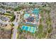 Aerial view of community amenities including a pool, tennis courts, playground, and clubhouse at 502 Helene Ct, Woodstock, GA 30188