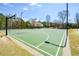 The outdoor basketball court features well-maintained surface, hoops, and surrounding trees at 502 Helene Ct, Woodstock, GA 30188