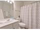Neutral toned bathroom with vanity, toilet, and shower at 502 Helene Ct, Woodstock, GA 30188