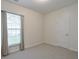 Bright bedroom with carpeted floors, a closet, and a window at 502 Helene Ct, Woodstock, GA 30188