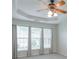 Bedroom features large windows and a ceiling fan at 502 Helene Ct, Woodstock, GA 30188