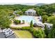 Aerial shot of a community pool area with a slide, lounge chairs, and a clubhouse at 502 Helene Ct, Woodstock, GA 30188