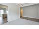 Open dining room area that flows into the kitchen, featuring neutral colors and modern lighting at 502 Helene Ct, Woodstock, GA 30188