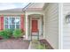 Welcoming front entrance with a red door, sidelights, and decorative trim at 502 Helene Ct, Woodstock, GA 30188