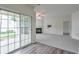 View of the carpeted living room with fireplace and sliding doors to patio at 502 Helene Ct, Woodstock, GA 30188