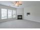 The living room with fireplace offers natural light from windows at 502 Helene Ct, Woodstock, GA 30188