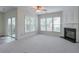 Spacious living room includes a fireplace and sliding doors to outdoor living at 502 Helene Ct, Woodstock, GA 30188