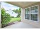 Covered patio area with views of the landscaped yard and surrounding neighborhood at 502 Helene Ct, Woodstock, GA 30188