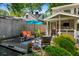 Backyard featuring a screened-in porch, brick patio, and a fish pond with water feature at 522 Trabert Nw Ave, Atlanta, GA 30309