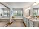 Bathroom featuring double sinks, and a large window with a seating area at 522 Trabert Nw Ave, Atlanta, GA 30309