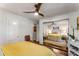 Bedroom with ample closet space with a large mirrored door, stylish decor and three-blade ceiling fan at 522 Trabert Nw Ave, Atlanta, GA 30309