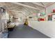 Clean and organized garage interior with ample storage shelves and a gray painted floor at 522 Trabert Nw Ave, Atlanta, GA 30309
