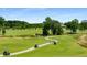 Scenic view of the golf course, complete with fairways, a bridge, and golf carts at 522 Trabert Nw Ave, Atlanta, GA 30309