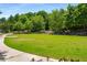 Expansive green space with manicured lawn and stone seating area at 522 Trabert Nw Ave, Atlanta, GA 30309