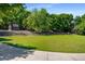 Large green space featuring a tiered seating area and lush trees at 522 Trabert Nw Ave, Atlanta, GA 30309