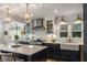 Stylish kitchen with island seating, stainless steel appliances, and modern lighting at 522 Trabert Nw Ave, Atlanta, GA 30309