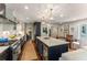 Bright and airy kitchen with large island, pendant lighting, modern appliances, and breakfast nook at 522 Trabert Nw Ave, Atlanta, GA 30309