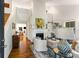 Bright living room with fireplace, hardwood floors, and high ceilings at 522 Trabert Nw Ave, Atlanta, GA 30309