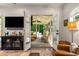 Bright living room with glass doors leading to a screened-in porch, enhancing indoor-outdoor living at 522 Trabert Nw Ave, Atlanta, GA 30309