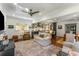 Open-concept living space with hardwood floors, comfortable seating, and natural light flowing from the kitchen at 522 Trabert Nw Ave, Atlanta, GA 30309