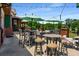 Inviting outdoor seating area with multiple tables, chairs, umbrellas, and picturesque views at 522 Trabert Nw Ave, Atlanta, GA 30309