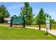 Entrance to the Bitsy Grant Tennis Center with lush greenery and clear signage at 522 Trabert Nw Ave, Atlanta, GA 30309