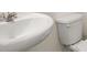 Close-up of white bathroom sink and toilet at 605 Lobelia Way, Locust Grove, GA 30248