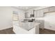 Well-lit kitchen with granite countertops, stainless steel appliances, and ample cabinet space at 605 Lobelia Way, Locust Grove, GA 30248