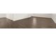 Spacious living room featuring hardwood flooring and ample natural light at 605 Lobelia Way, Locust Grove, GA 30248