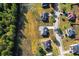 Aerial view of a residential neighborhood with well-maintained lawns and tree-lined streets at 191 Kyndal Dr, Hampton, GA 30228