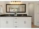 Stylish bathroom with a double sink vanity with granite countertop and vanity lighting at 191 Kyndal Dr, Hampton, GA 30228