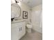 Well-lit bathroom boasts sleek fixtures, a granite countertop vanity and a shower-tub combination at 191 Kyndal Dr, Hampton, GA 30228