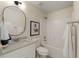 Bright bathroom with granite countertop vanity and shower-tub combination at 191 Kyndal Dr, Hampton, GA 30228