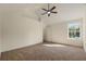 Bedroom featuring a ceiling fan, vaulted ceilings, and a window allowing for natural light at 191 Kyndal Dr, Hampton, GA 30228
