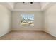 Large bedroom with a window providing ample natural light and views of the surrounding neighborhood at 191 Kyndal Dr, Hampton, GA 30228