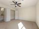 Spacious bedroom featuring a ceiling fan and natural light at 191 Kyndal Dr, Hampton, GA 30228