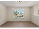 Well-lit room with wood flooring and a large window at 191 Kyndal Dr, Hampton, GA 30228