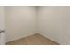 Empty closet featuring laminate flooring and neutral wall paint at 191 Kyndal Dr, Hampton, GA 30228