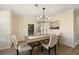 Bright dining area with modern lighting and wainscoting, great for Gathering meals and entertaining guests at 191 Kyndal Dr, Hampton, GA 30228