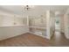 Upstairs hallway with wood flooring and stylish light fixtures at 191 Kyndal Dr, Hampton, GA 30228