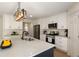 Bright kitchen featuring white cabinets, stainless appliances, and quartz countertops at 191 Kyndal Dr, Hampton, GA 30228